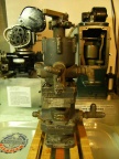 A vintage Woodward aircraft engine governor with a hydraulic oil pump attached